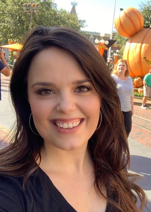 Kimberly J. Brown smiling in a picture at Disneyland
