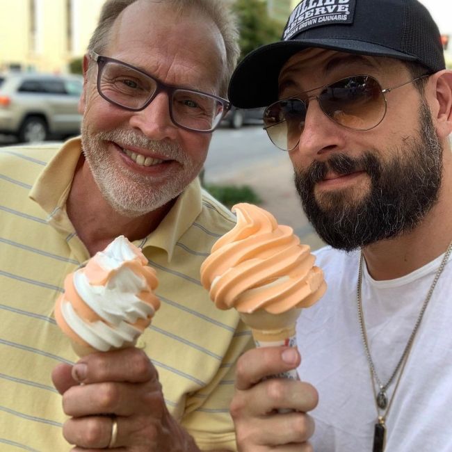 Matthew as seen smiling with his father in June 2019