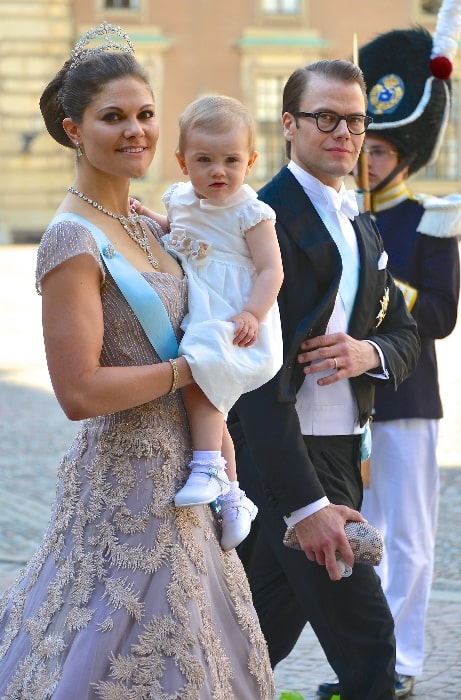 Prince Daniel and Crown Princess Victoria with their daughter on the way to the castle church at the Royal Palace in Stockholm for the wedding between Princess Madeleine and Christopher O'Neill