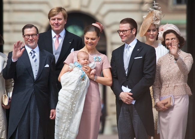 Princess Estelle, Duchess of Östergötland with her parents, grandparents, and godparents after her baptism in Stockholm, Sweden in May 2012