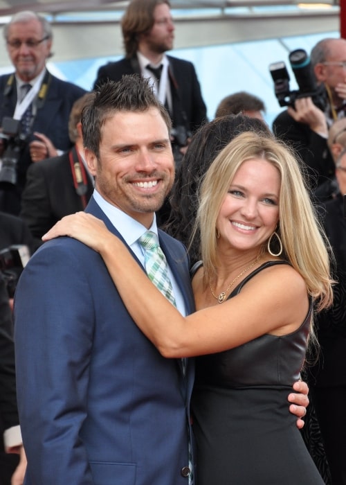 Sharon Case posing for a picture alongside Joshua Morrow at the 2013 Monte-Carlo Television Festival