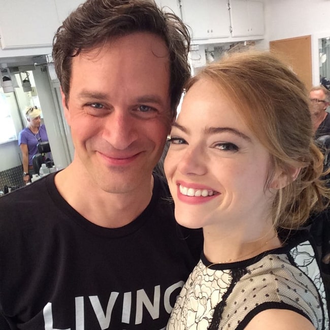 Tom Everett Scott smiling for a picture alongside Emma Stone in September 2015