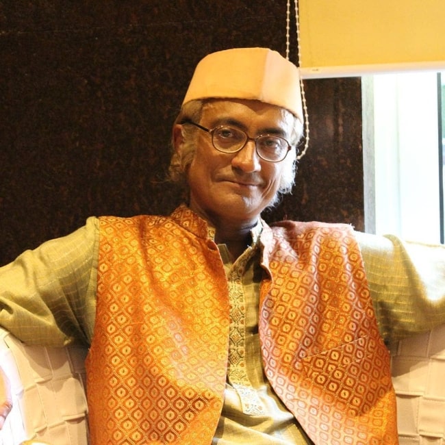 Amit Bhatt smiling for a picture while dressed as Champaklal Jayantilal Gada from 'Taarak Mehta Ka Ooltah Chashmah'