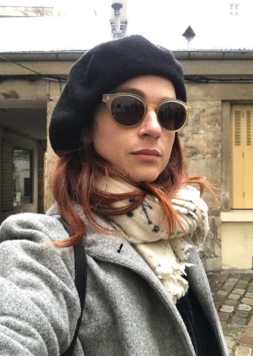 Aya Cash in December 2017 sharing her selfie wearing the beret she bought as a tourist in Paris