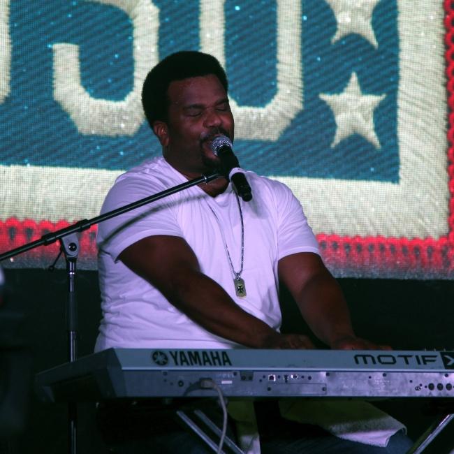 Craig Robinson sings his songs in his stand-up comedy musical act during The Today USO Comedy Tour Show held at Bagram Air Field, Afghanistan on October 1, 2014