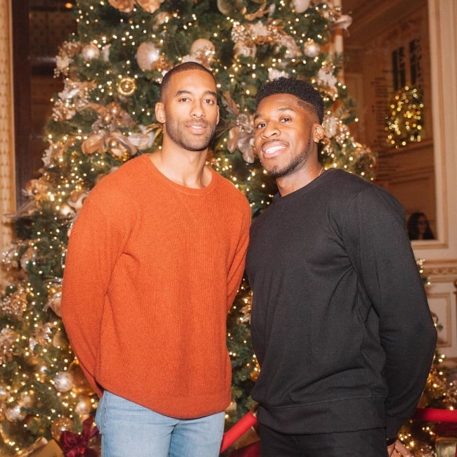 Matt James (Left) as seen in a Christmas picture alongside Chill Smith in New York City, New York in December 2019