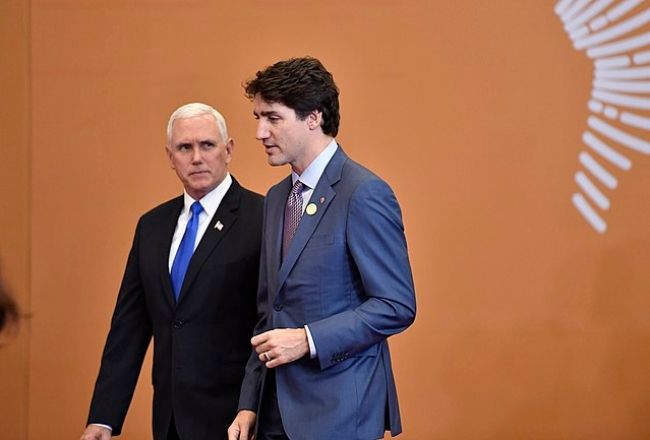 Mike Pence as seen walking alongside Canadian Prime Minister Justin Trudeau in 2018