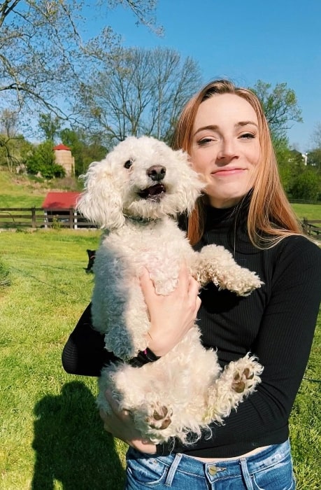 Sarah Mezzanotte as seen while posing for a picture with a dog in May 2020