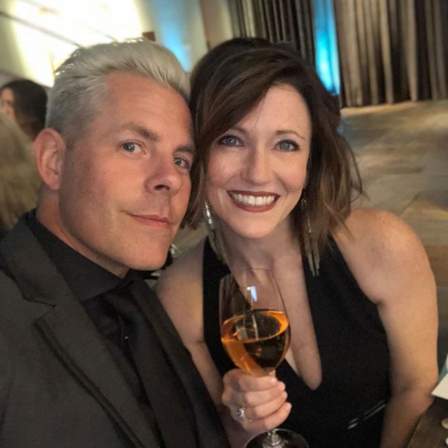 Trevor and his wife posing together on their wedding anniversary in 2019