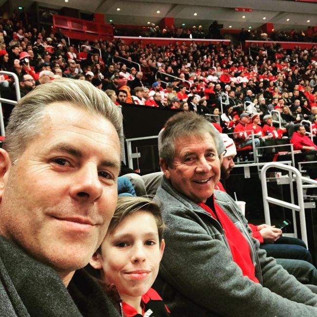 Trevor as seen with his father and son during a Detroit Red Wings hockey match in 2018