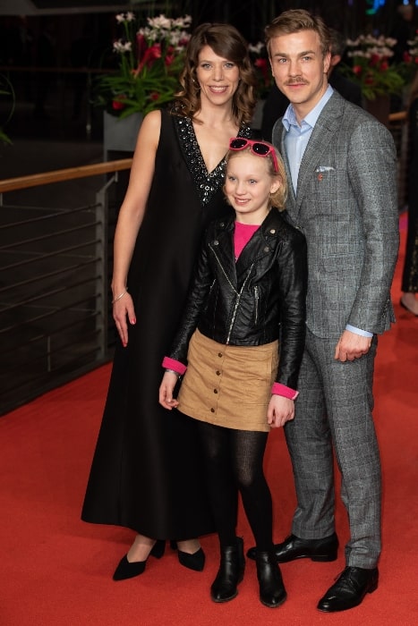 A young Helena Zengel posing for the camera along with Nora Fingscheidt and Albrecht Schuch on the red carpet of the Berlinale closing gala 2019