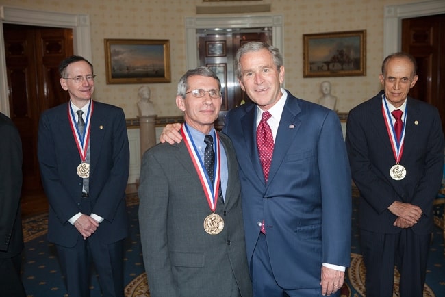 Anthony Fauci (Center Left) with President George W. Bush upon receiving the National Medal of Science in 2007. Also pictured are Dr. Tobin J. Marks (Corner Left) and Dr. Bradley Efron (Corner Right)