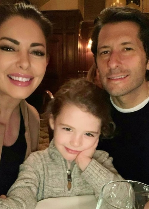 Bobbie Thomas smiling in a picture alongside her late husband and their son in New York City in January 2020