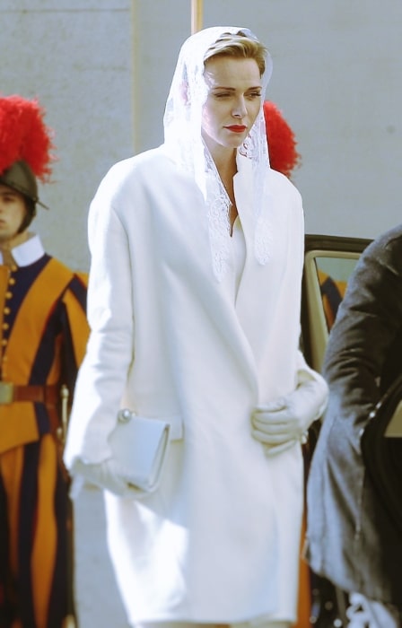 Charlene, Princess of Monaco wearing white garments on an official state visit to the Vatican in 2016