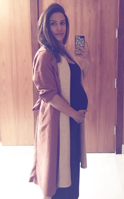 Christie Laing as seen while taking a mirror selfie showing her baby bump in May 2019