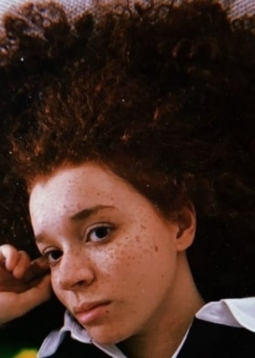 Erin Kellyman in April 2018 trying best to ignore the fact that she has to comb through her hair after washing it