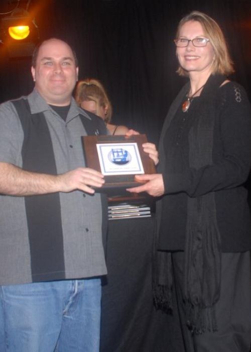 Maud Adams as seen presenting Jeffrey Howard with the award for Best TV Writing in 2008