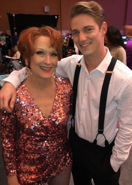 Nico Greetham smiling for a picture alongside Meryl Streep at Paramount Studios in December 2020