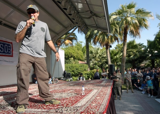 Robin Williams as seen while performing for the audience at an all-hands gathering aboard Naval Support Activity Bahrain in December 2003