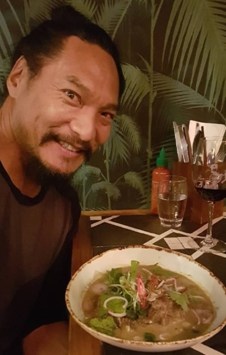 Jason Scott Lee taking a selfie with his food in November 2018