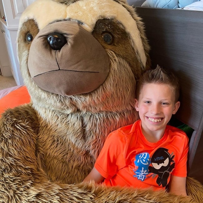 Paxton Myler as seen in a picture with a large sloth soft toy April 2020