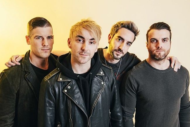 Rian Dawson (extreme right) as seen with his band members from All Time Low