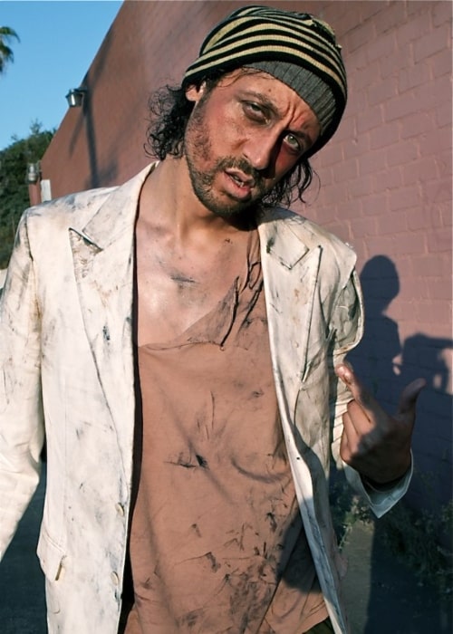 Santino Rice playing the role of a homeless man in the adult film L.A. Zombie in 2010