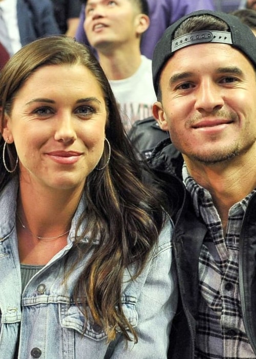 Servando Carrasco and Alex Morgan, as seen in December 2019