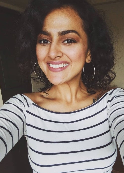 Shraddha Srinath as seen while smiling for a selfie in Koduvayur in December 2020