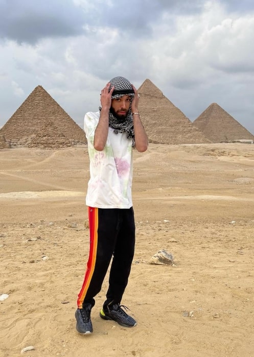 Adam G. Sevani posing in front of the pyramids in December 2020