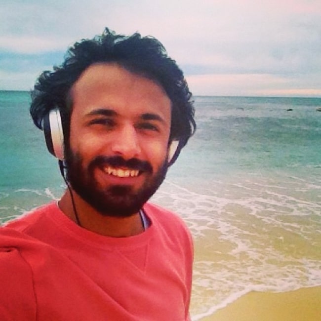 Advait Chandan smiling for a picture at Bronte Beach in August 2013