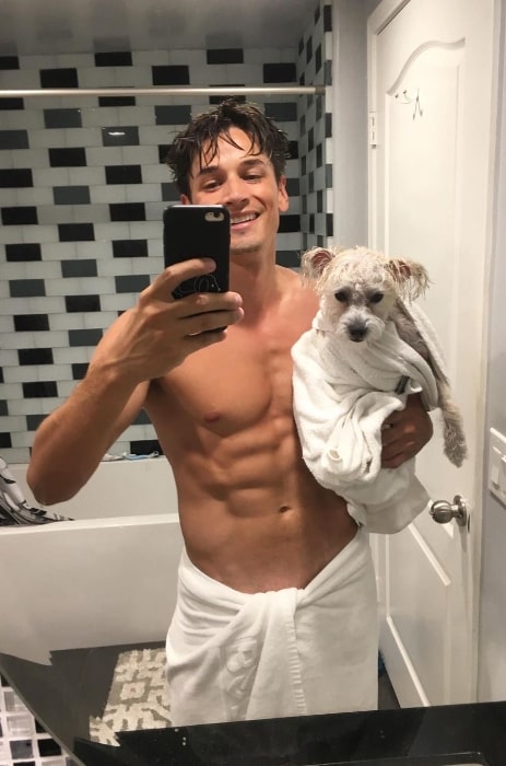 Andrew Gray as seen while clicking a shirtless mirror selfie with his dog in Hancock Park, Los Angeles in December 2019