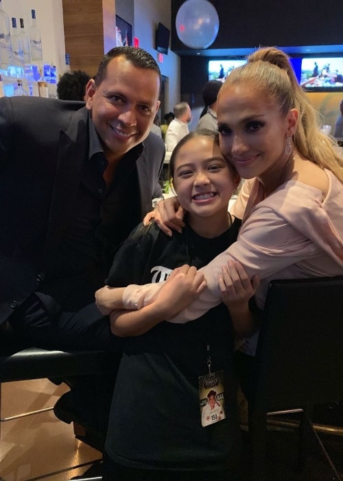 Kea Peahu (Center) as seen while smiling in a picture alongside Jennifer Lopez and Alex Rodriguez in July 2019