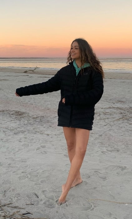 Madison Bailey posing for a picture while enjoying her time at a beach in December 2020