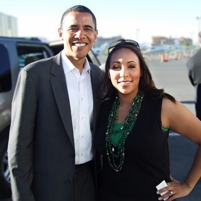 Mara Schiavocampo posing for a picture alongside Barack Obama