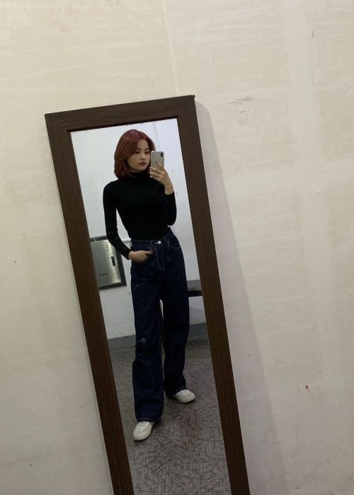 Rina as seen taking a mirror selfie in November 2020