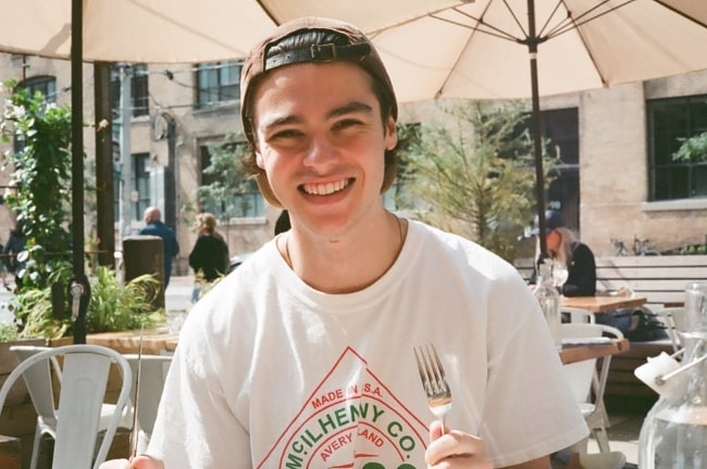 Felix Mallard smiling for the camera in Toronto, Ontario in September 2019