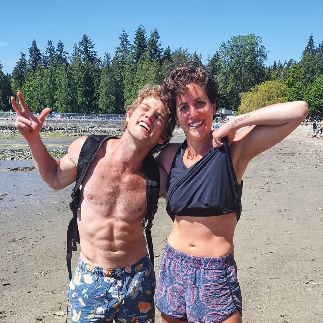 Jedidiah Goodacre (Left) posing shirtless for a picture along with Jess Smith at English Bay in Vancouver, British Columbia, Canada, in July 2017