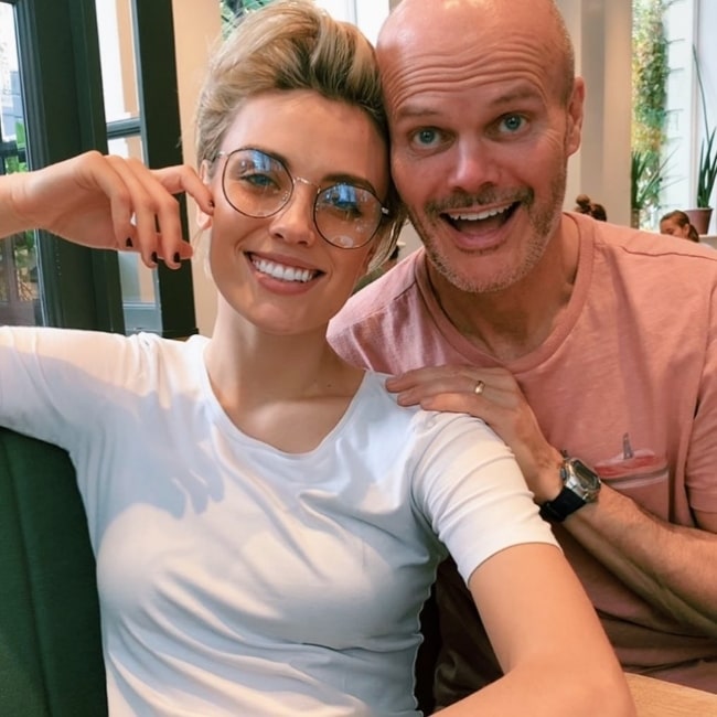 Wallis Day smiling in a picture alongside her father in London, United Kingdom