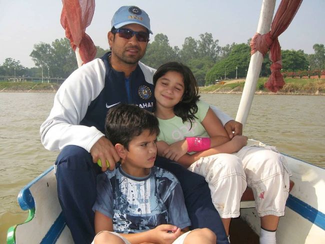 A young Arjun as seen with his father and sister