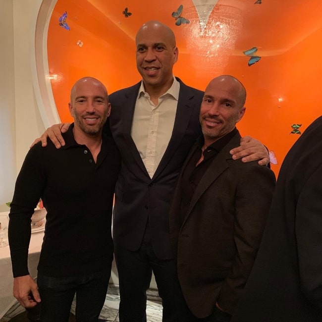 Brett Oppenheim as seen in a picture with his brother Jason Oppenheim and United States Senator Cory February 2019