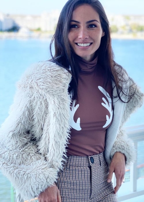 Caitlin McHugh as seen while smiling for the camera at Disney's Boardwalk Resort in December 2019