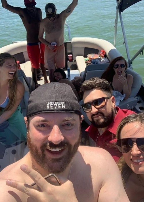 Chris Young with friends on a yacht in June 2022