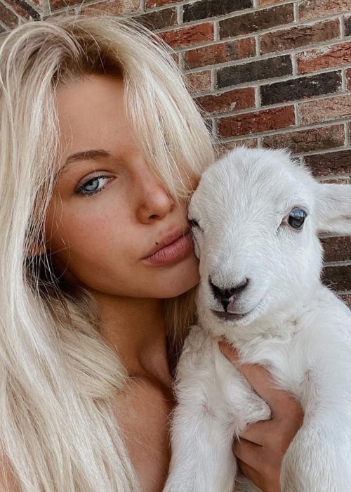 Genevieve Madison as seen in a selfie with a sheep in Burgin, Kentucky in March 2021