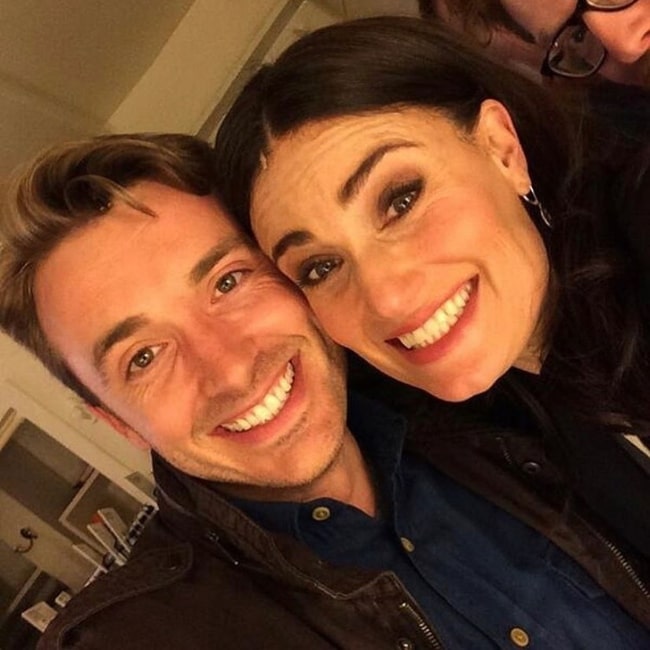 James Snyder smiling in a selfie alongside Idina Menzel in New York City, New York in March 2020