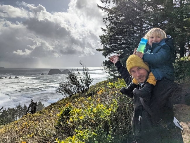 John Robinson with his son in Cape Meares, Oregon in March 2021