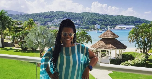 Kelly Jenrette posing for a stunning picture during her vacation in Jamaica in November 2019