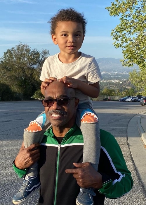 Michael Beach with his child in 2021