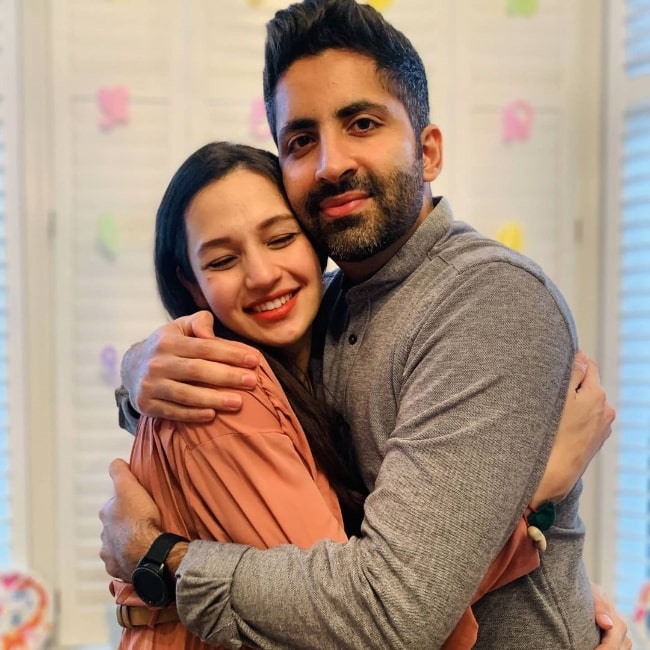 Suhani Dhanki smiling for the camera alongside her husband Prathmesh Mody