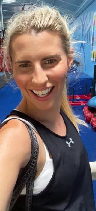 Tiffiny Hall in April 2021 taking a gym selfie after completing a good workout